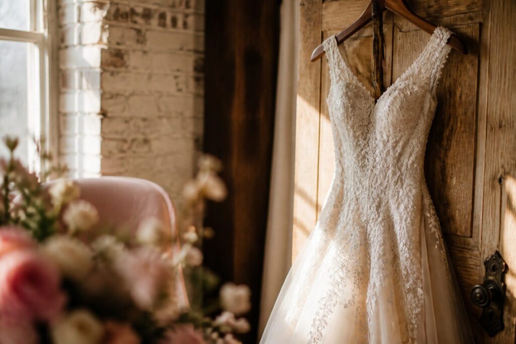 A couple in wedding attire sharing a tender moment.